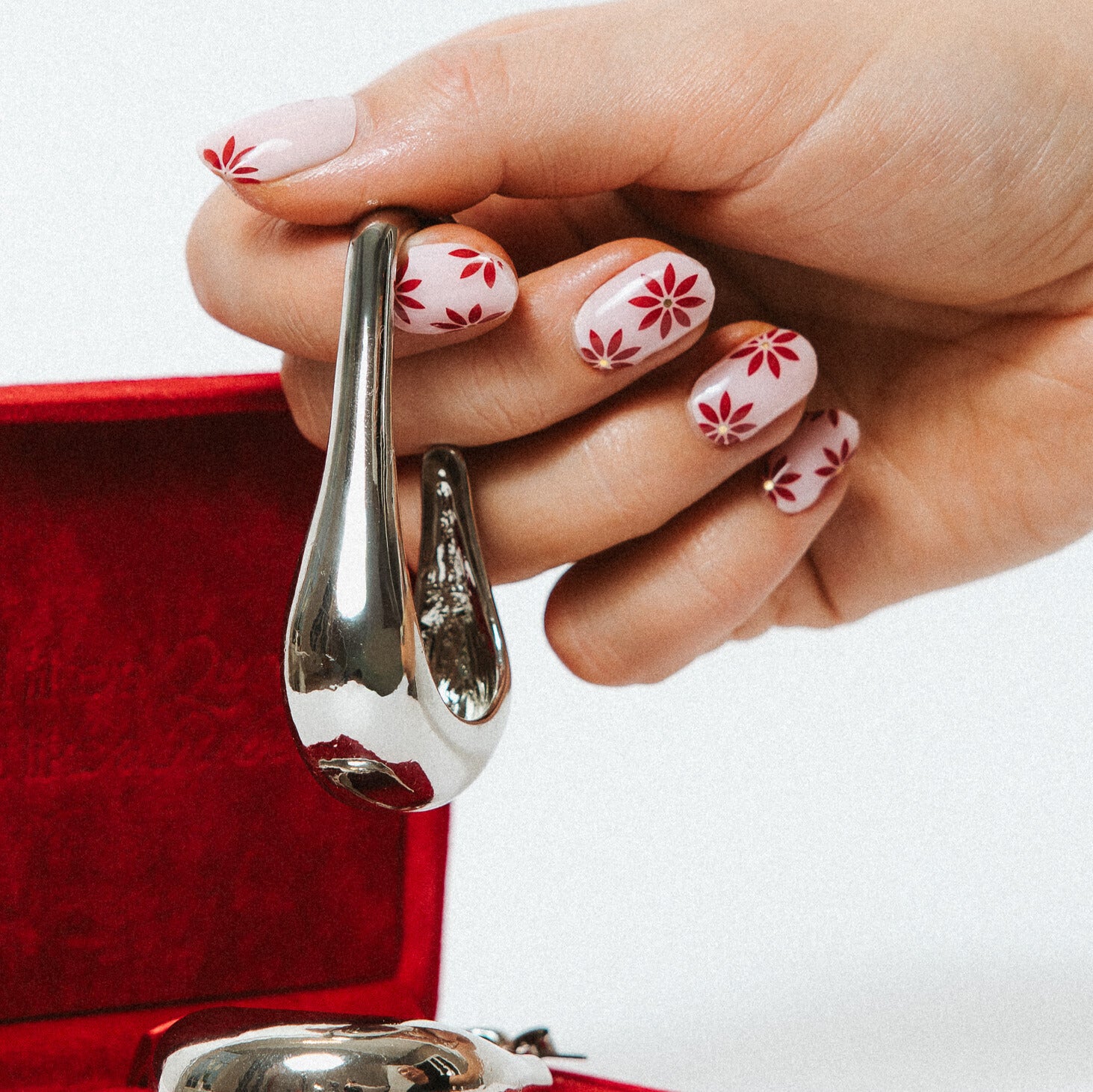Blushberry Maniac Nails with Pink with red and gold flower nail art with Silver earring
