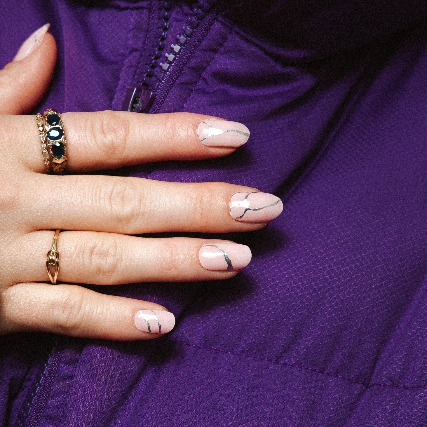 Silverline Bliss Maniac Nails Light pink with silver cracks/lines of stone nail art design stickers on hand with purple jacket