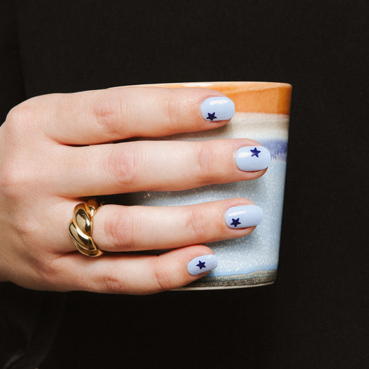 Blue Wish nail art stickers by Maniac Nails, baby blue gel nails with a navy star on each nail