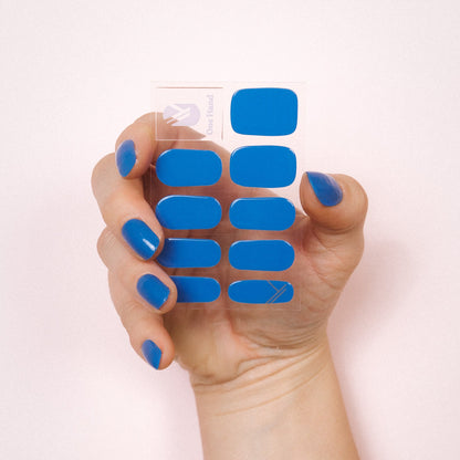 Bobby Blue Maniac nails bright blue gel stickers on hand and sheet 