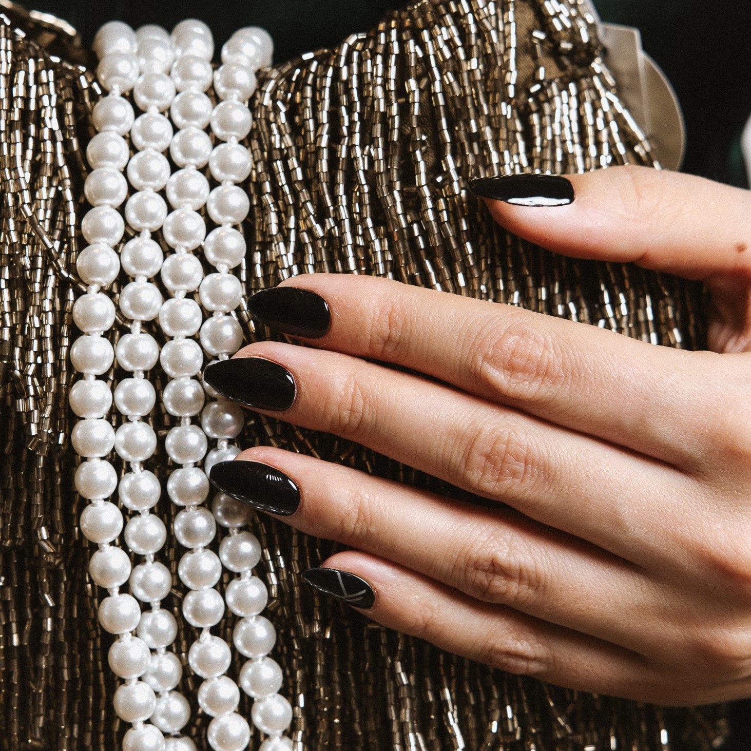 Bowie black Maniac nails gel stickers on hand with pearls and gold glitters