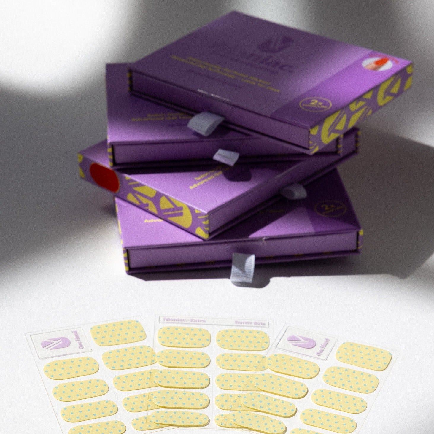 Butter Dots gel nail sticker sheets by Maniac Nails, butter yellow nail wraps and packaging