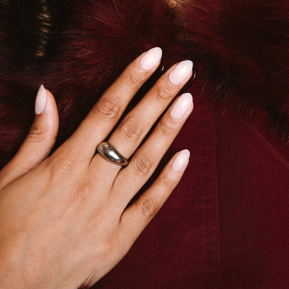Family first Maniac nails Anna Nooshin design light pink on nail with gold ring and dark red jacket with fur 