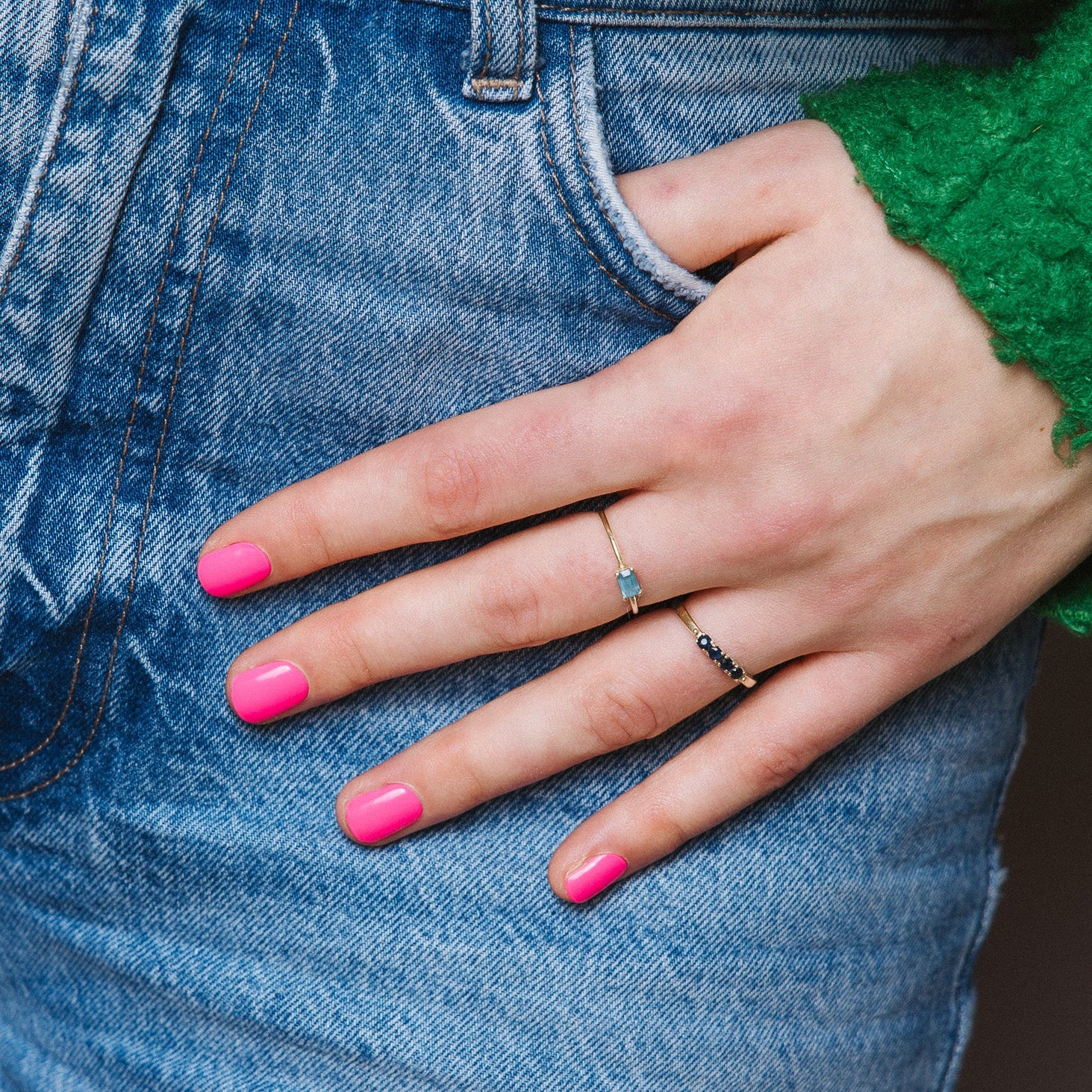 Gaga Pink Maniac Nails bright pink gel stickers on hand with jeans 