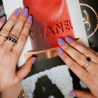 Happy Hour lilac purple gel nail stickers by Maniac Nails, hands forming a heart shape in golden sunlight