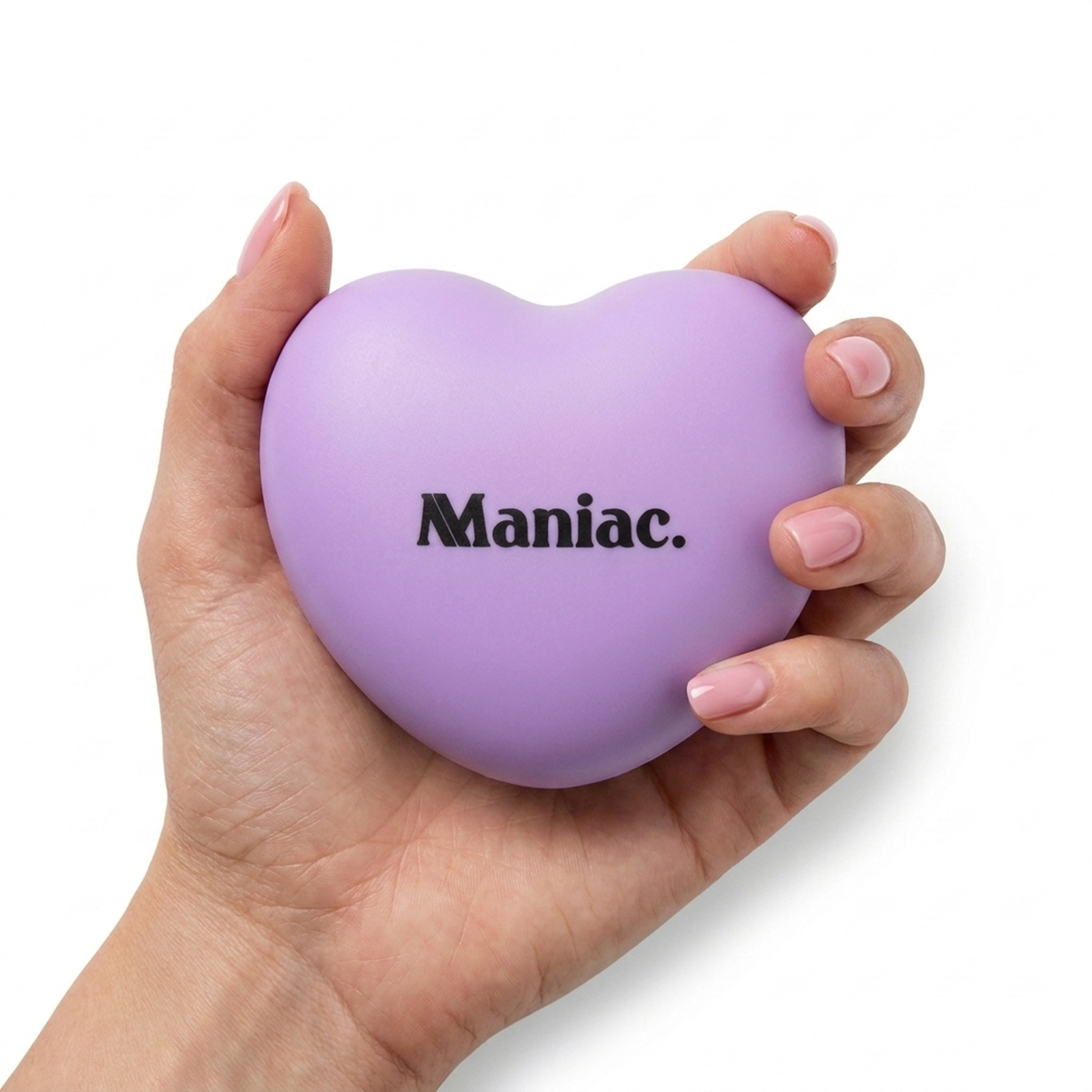 Rechargeable LED Nail Lamp by Maniac Nails held in a hand, palm sized lilac heart shaped nail lamp