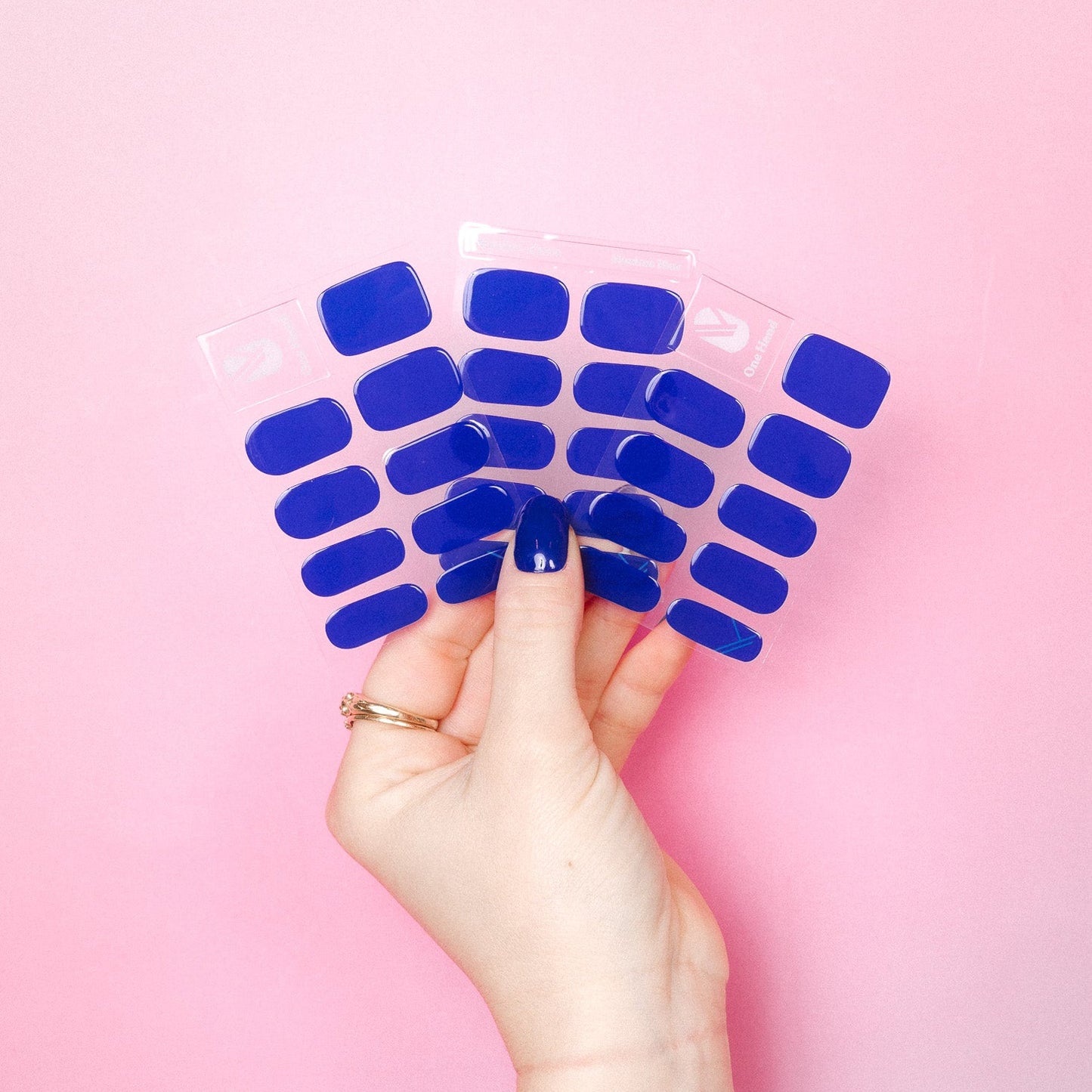 Maxima Blue Maniac nails royal blue stickers on hand and sheet 