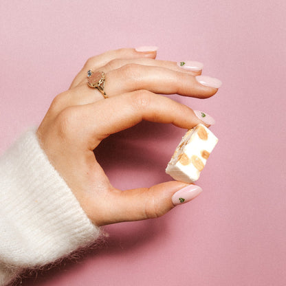 Minimal Crush Maniac Nails Light pink with green heart nail art on hand with candy and ring 