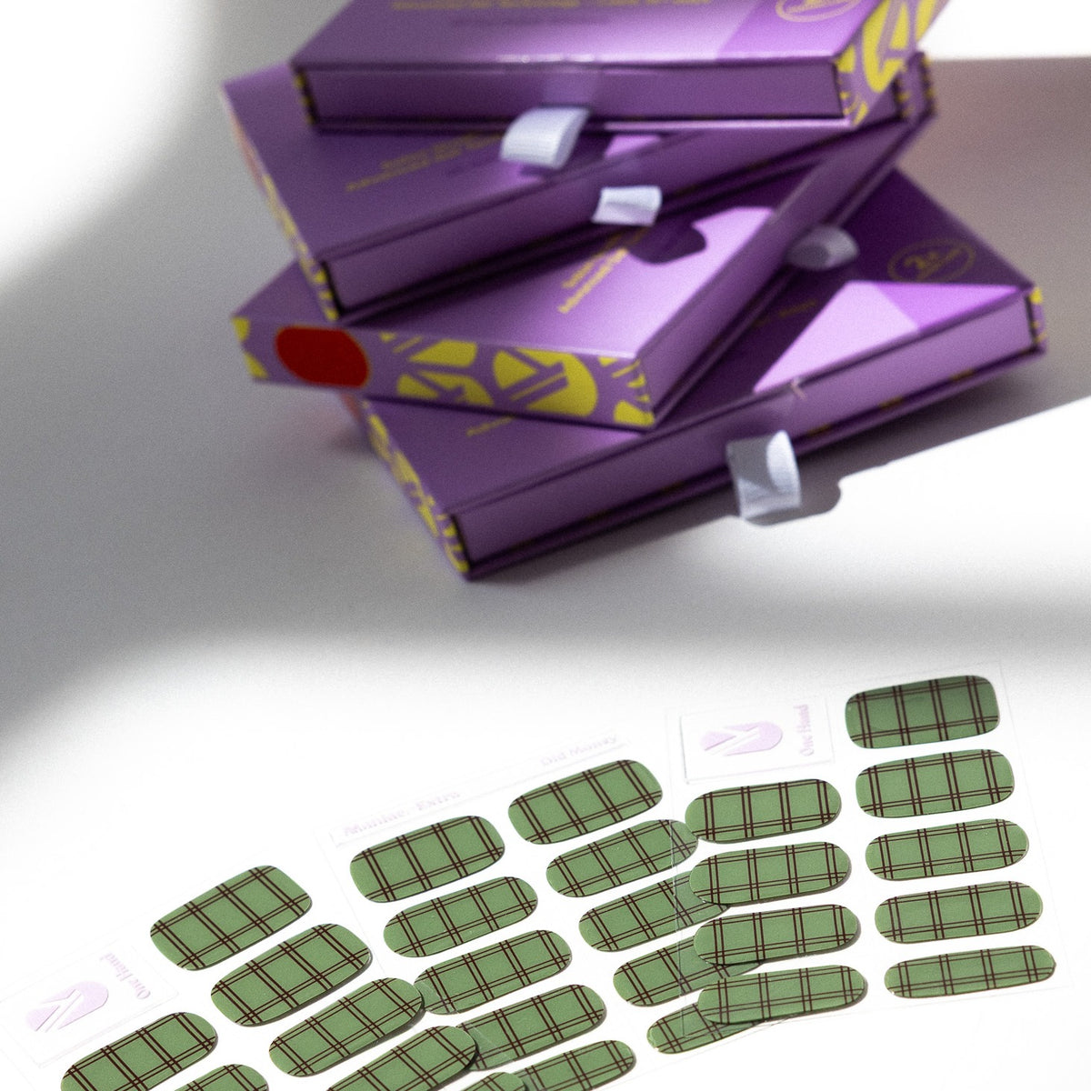 Old Money gel nail sticker sheets by Maniac Nails, sage green check nail wraps and packaging