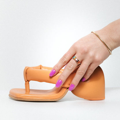 Pukka Purplke Maniac Nails bright purple nail design stickers on hand with orange heel 