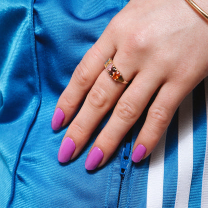 Pukka Purple Maniac Nails bright purple nail design sticker on hand with blue adidas pants 