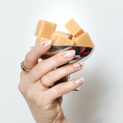 Silverline Bliss Maniac Nails light pink with silver marble cracks/lines nail art design stickers on hand with carmel cubes in cup