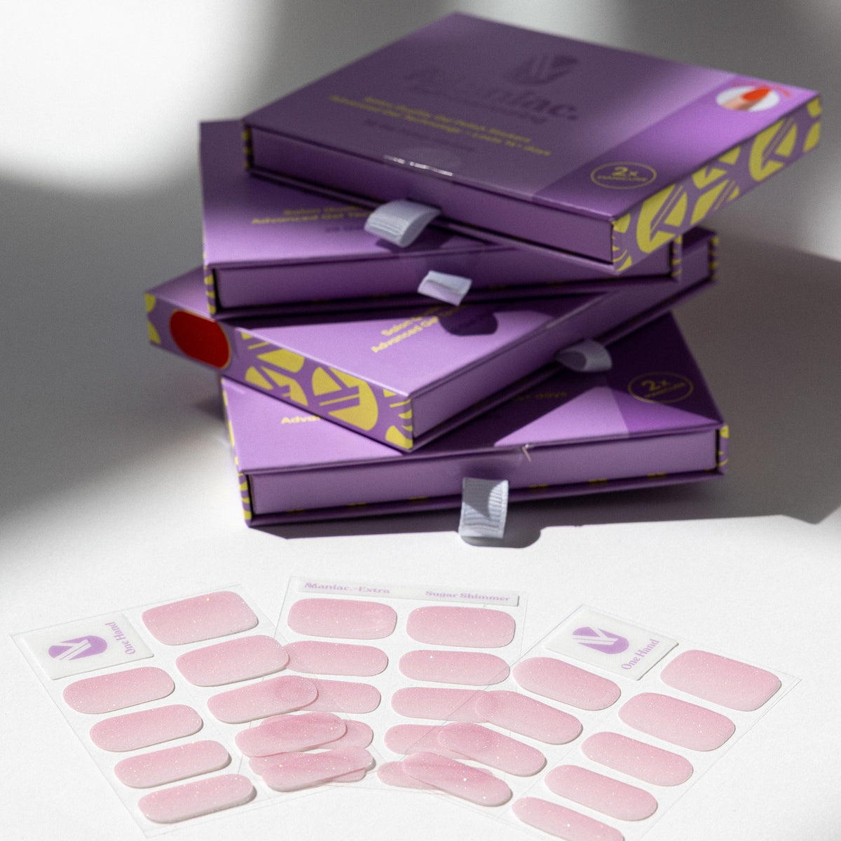 Strawberry Glaze gel nail sticker sheets by Maniac Nails, milky pink nail wraps and packaging
