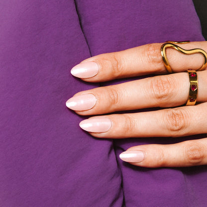 Close-up of Strawberry Glaze gel nail stickers by Maniac Nails, soft pink shimmer nails