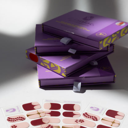 The Whole Bunch gel nail sticker sheets by Maniac Nails, nude and red floral nail wraps and packaging
