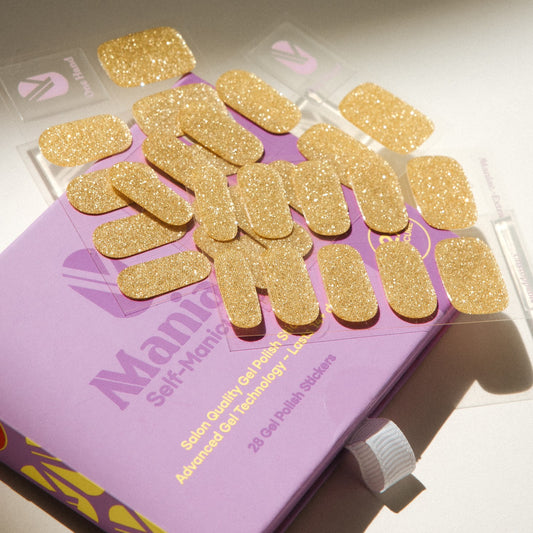 Unstoppable gold glitter gel nail sticker sheets by Maniac Nails with packaging