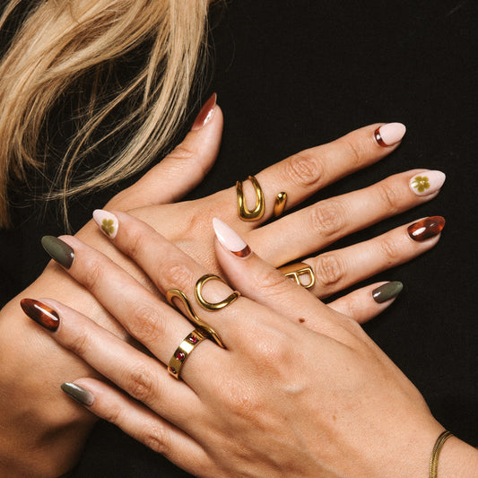 Hands with Vintage Olive gel nail stickers by Maniac Nails, olive green and tortoise brown nails